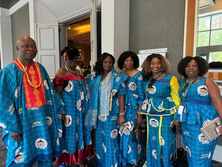 Convention attendees wearing coordinated blue traditional attire