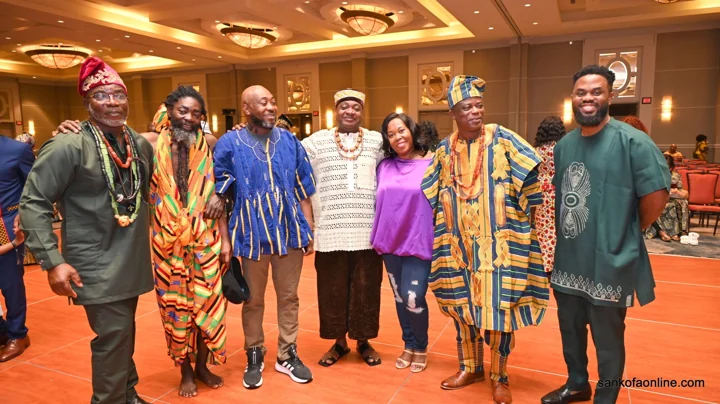 Convention guests posing together in colorful formal attire
