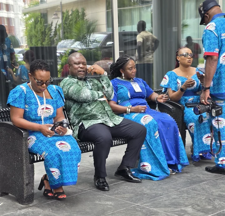 Convention attendees relaxing together on an outdoor patio
