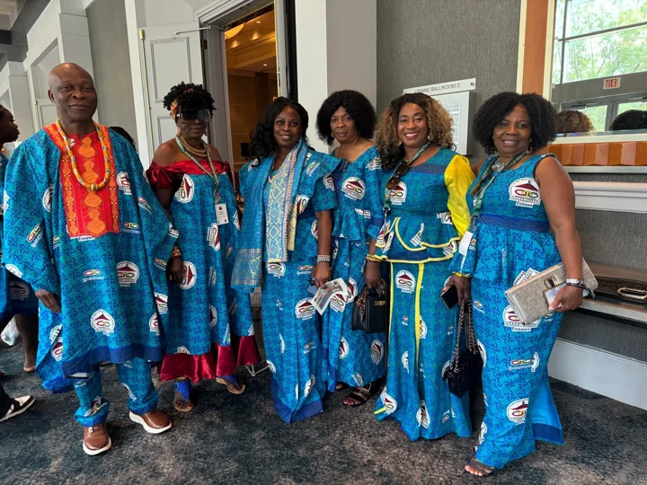 Convention attendees posing in coordinated blue attire
