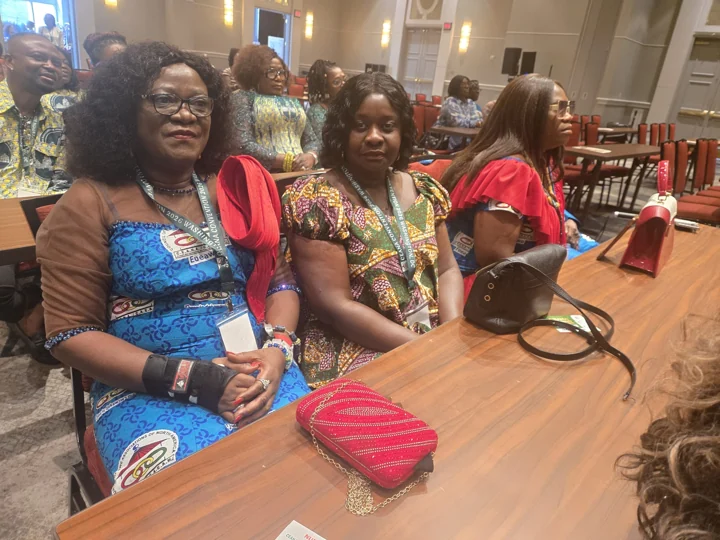 Attendees seated together at a convention table