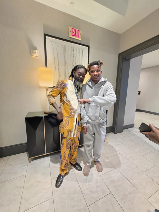 Two convention guests posing in formal attire
