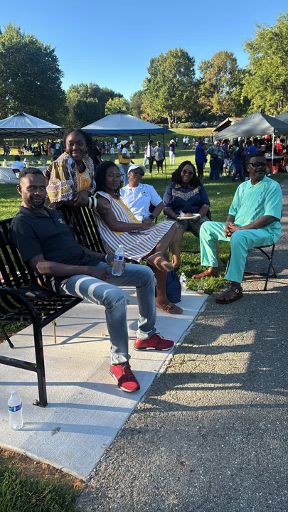 Convention attendees sitting together outdoors
