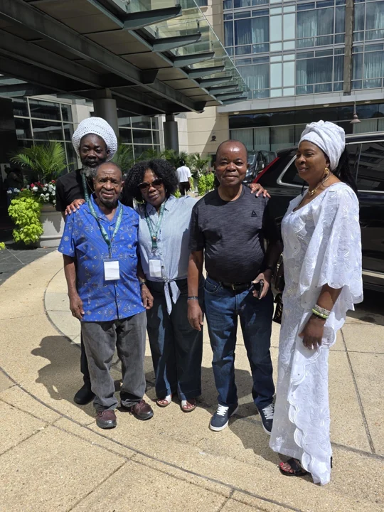 Convention guests posing together outside the hotel